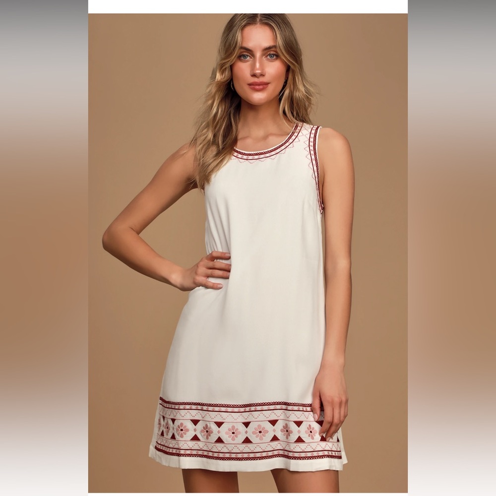 White embroidered shift dress.
